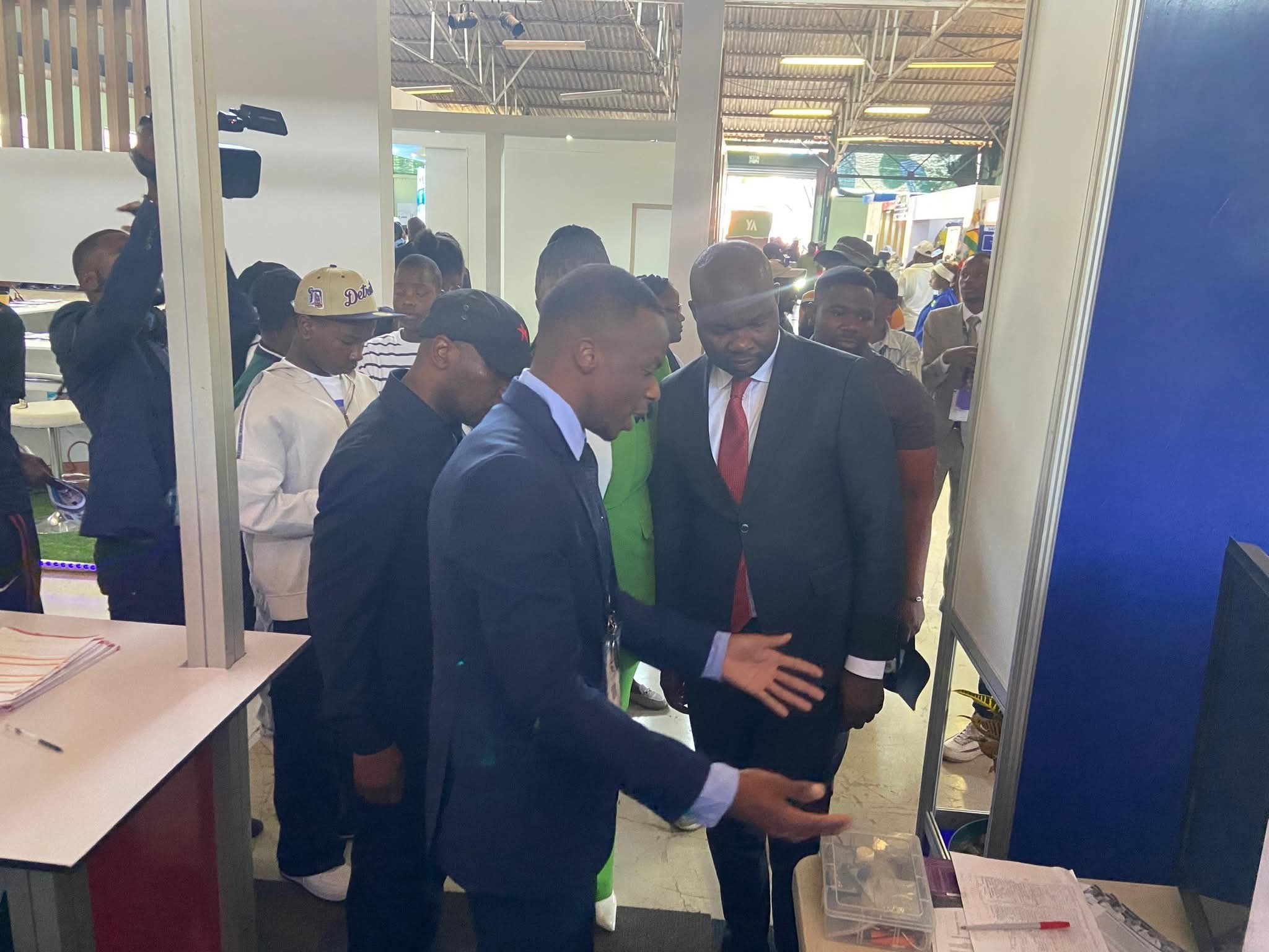 Exhibition booth product demonstration with visitors